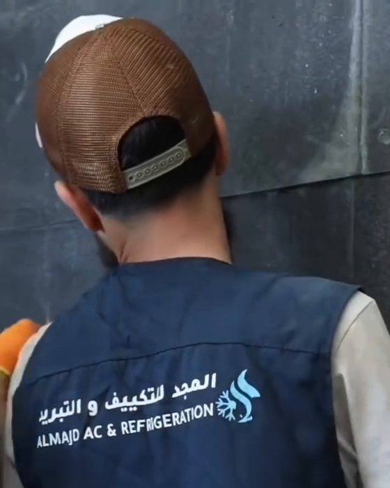 An MTK technician in branded uniform working on site